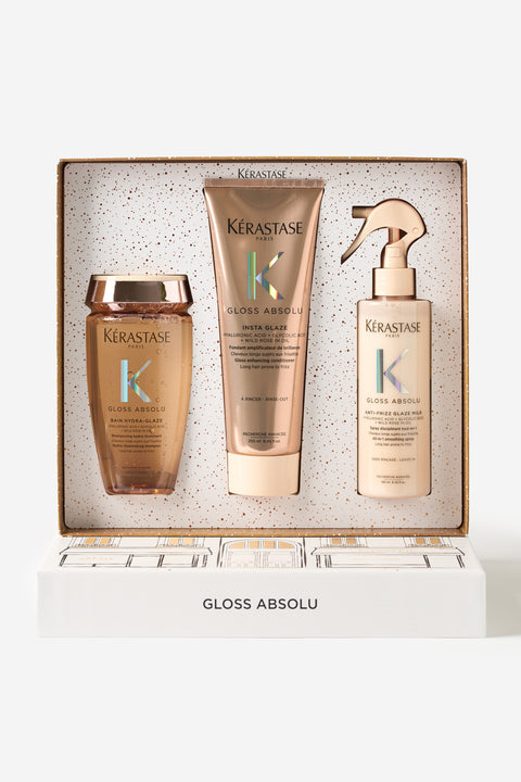Coffret cadeau du temps des fêtes de la gamme Gloss Absolu de Kérastase. Les produits sont le shampooing Bain Hydra-Glaze, l'après-shampoing Fondant Insta-Glaze et le spray protecteur Anti-Frizz Glaze Milk.