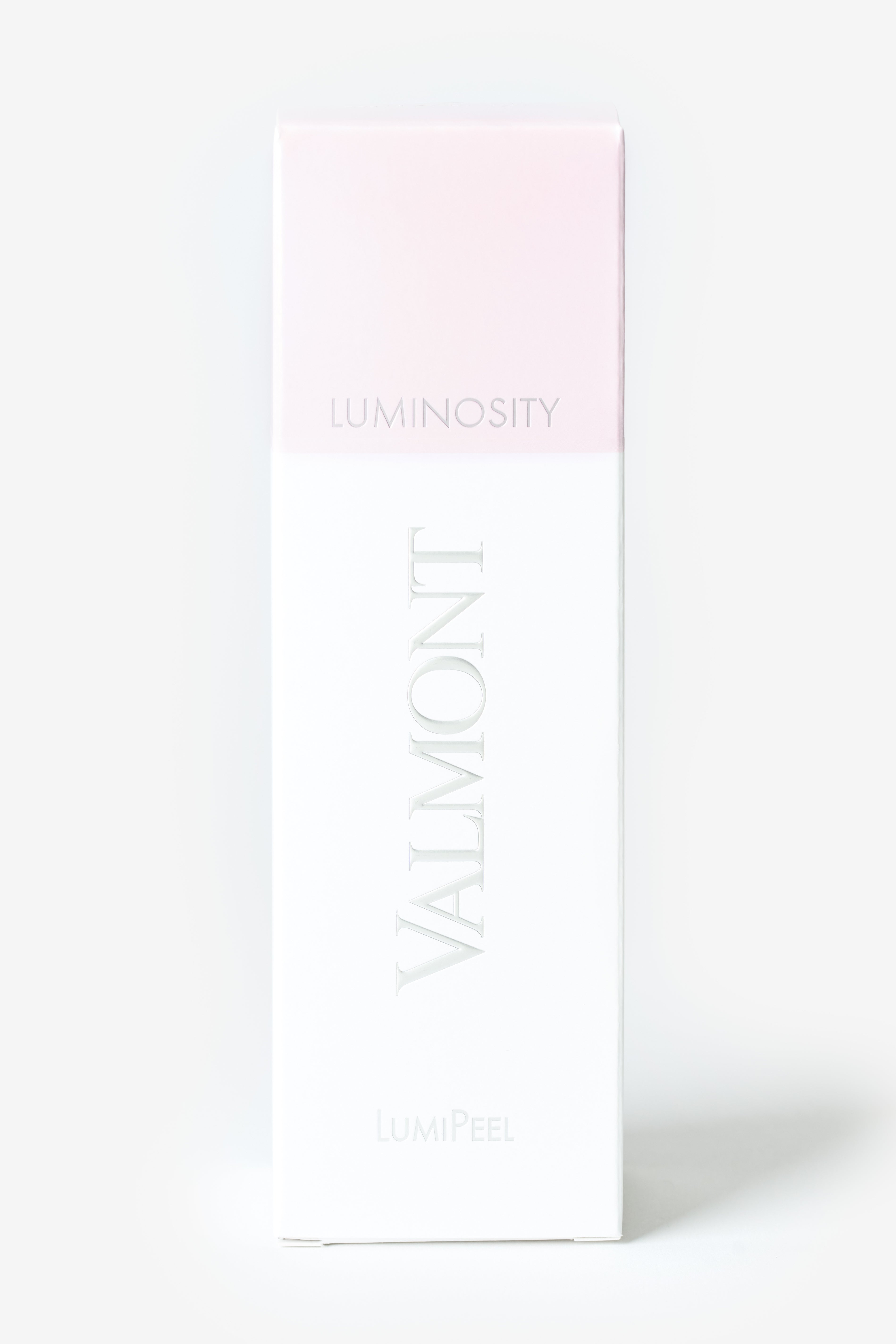 Le boîte blanche Valmont avec une bande rose sur le dessus.