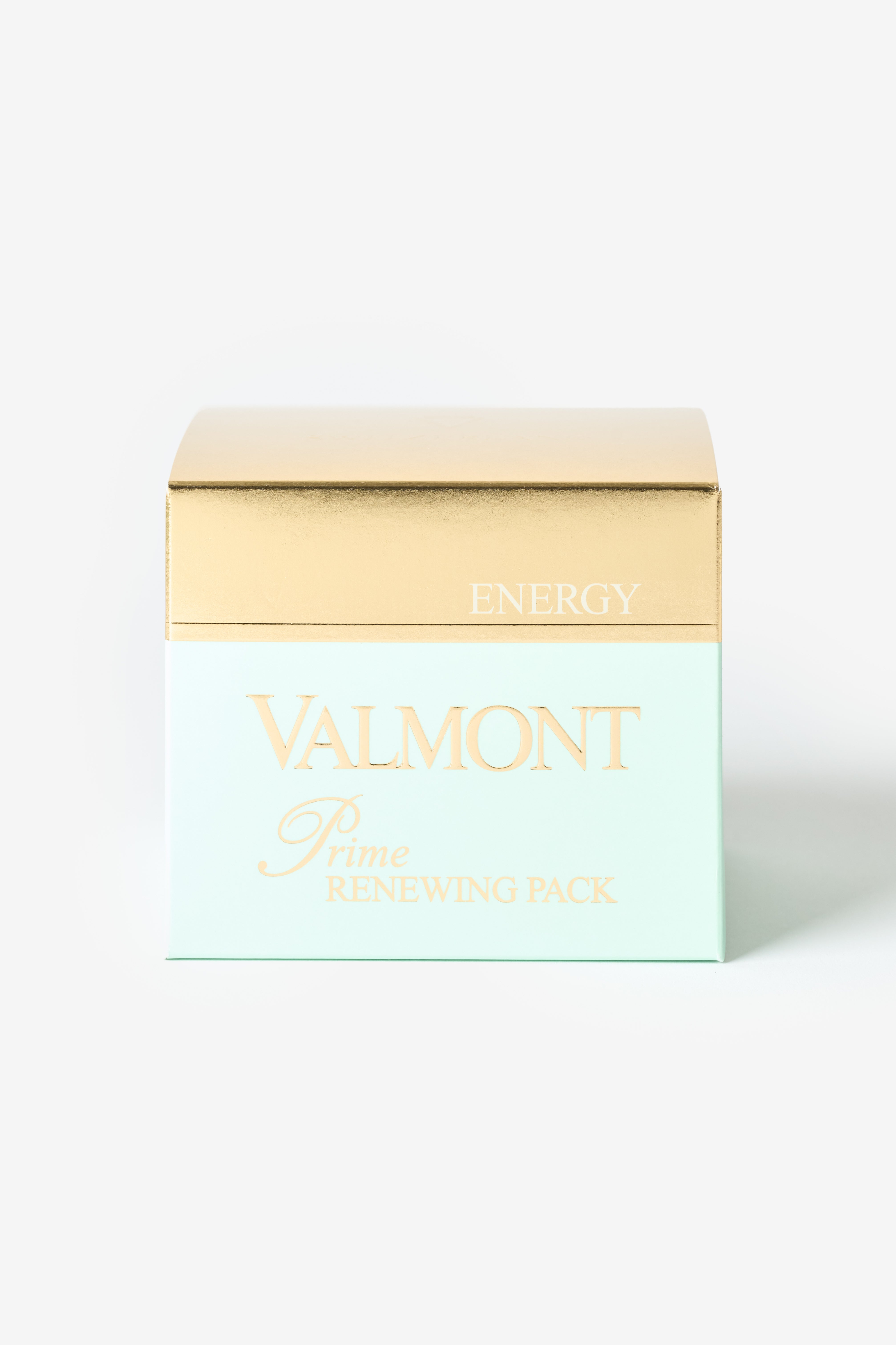 Une boîte blanche aux teintes verdâtres Valmont avec une bande dorée.