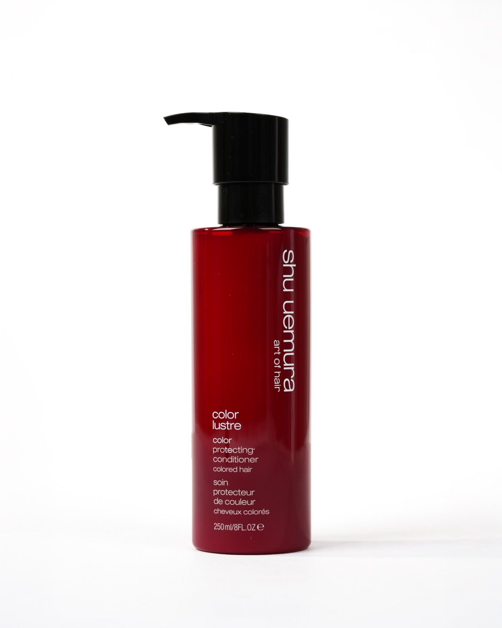 Bouteille cylindrique de couleur rouge du revitalisant color lustre de shu uemura 
