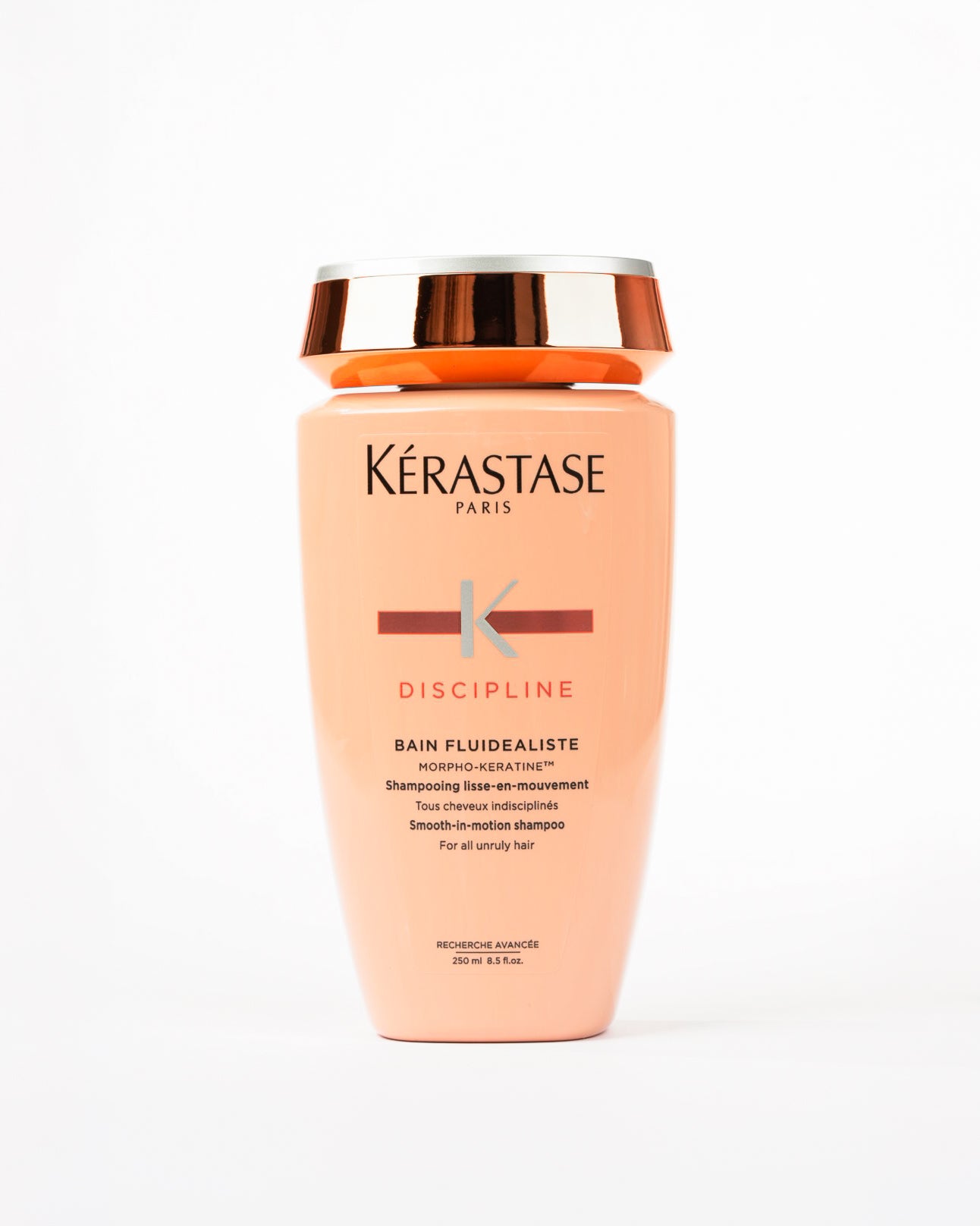 Bouteille de shampooing orange claire bain fluidealiste de Kérastase 