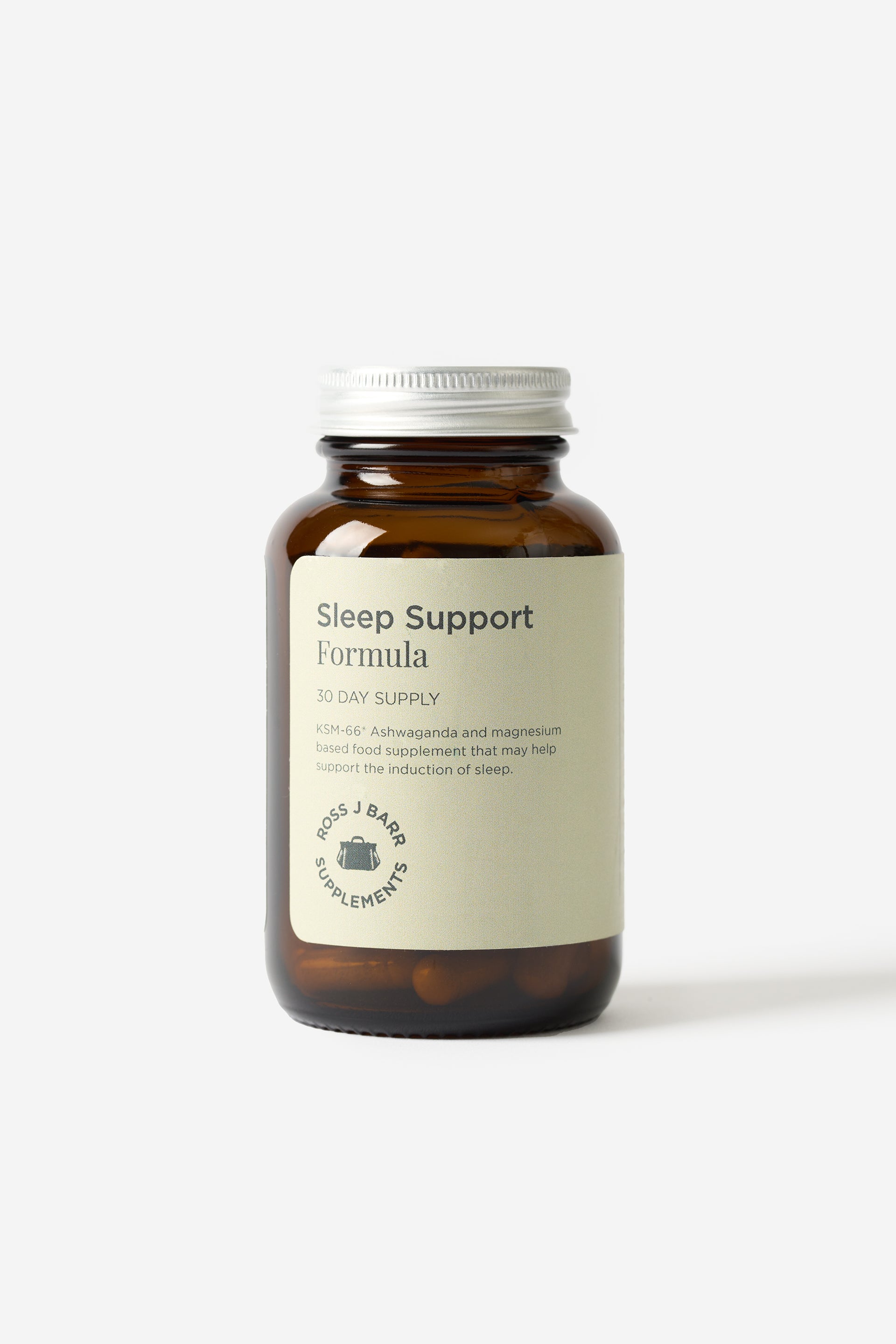 Les suppléments Sleep Support Formula de Ross J Barr sont dans une bouteille en vitre sur un fond blanc.