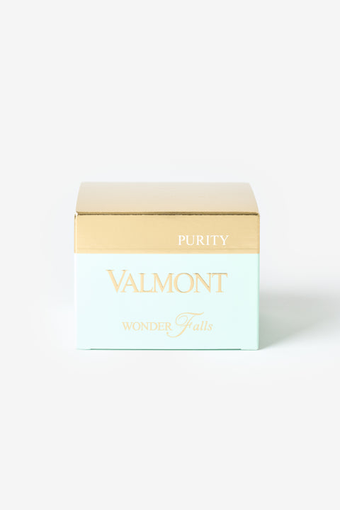 La boîte blanche aux teintes verdâtres Valmont avec une bande dorée.